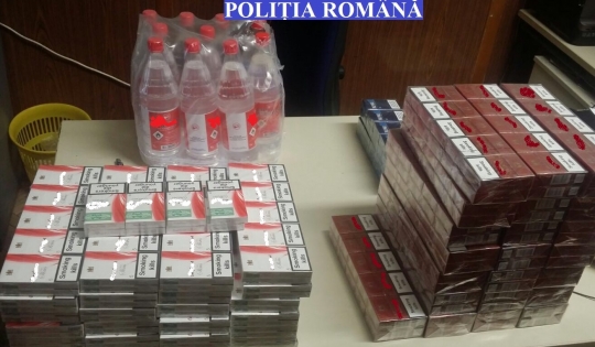 Cantități mari de alcool și țigări de contrabandă găsite de polițiști în urma unor percheziții făcute la două magazine din Berchișești